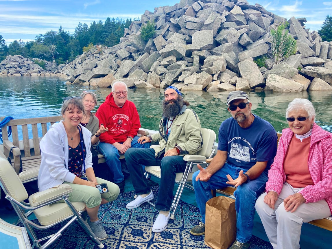 Family on back of boat. Good Tide Tours.